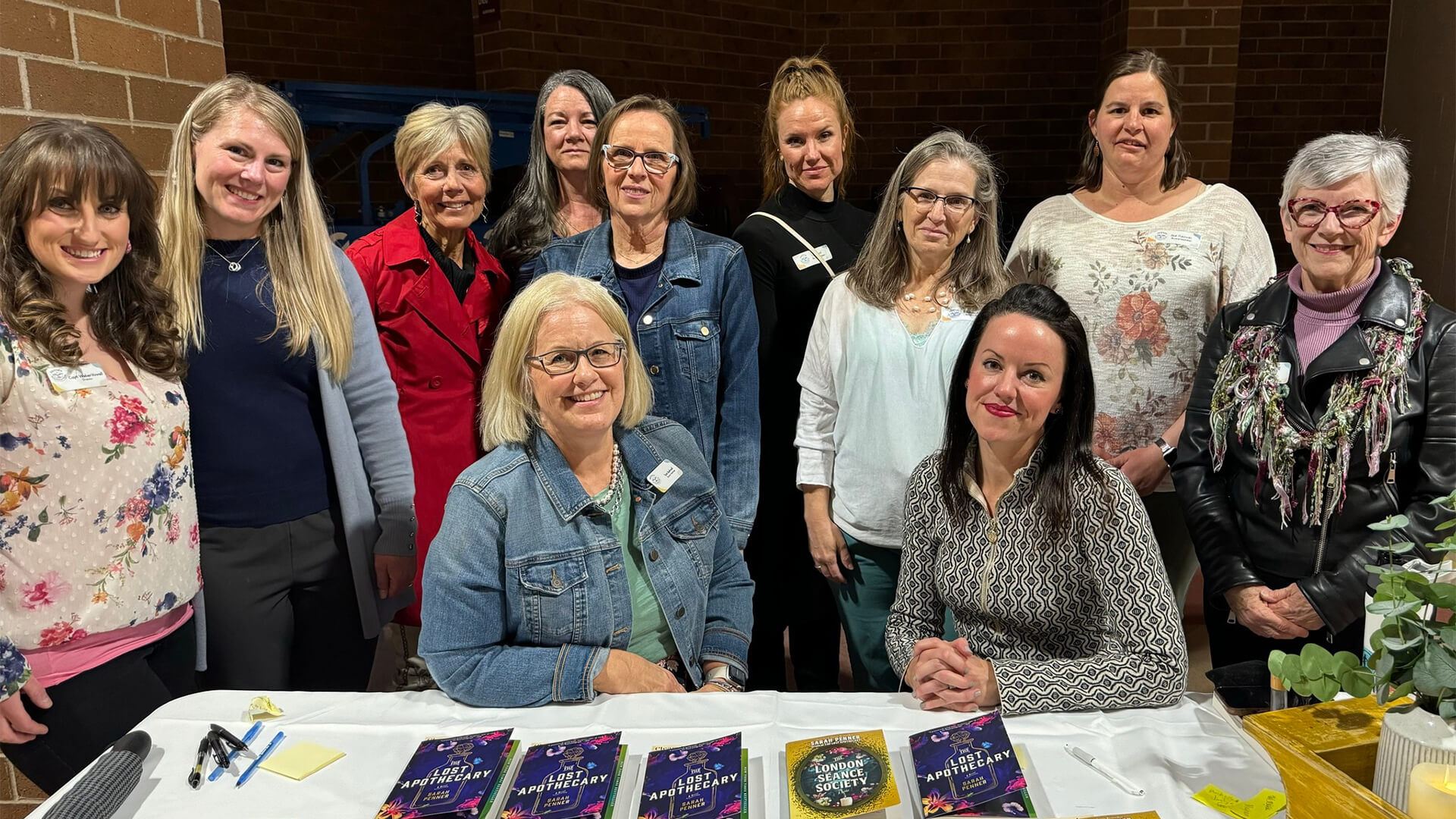 Women at a table with books